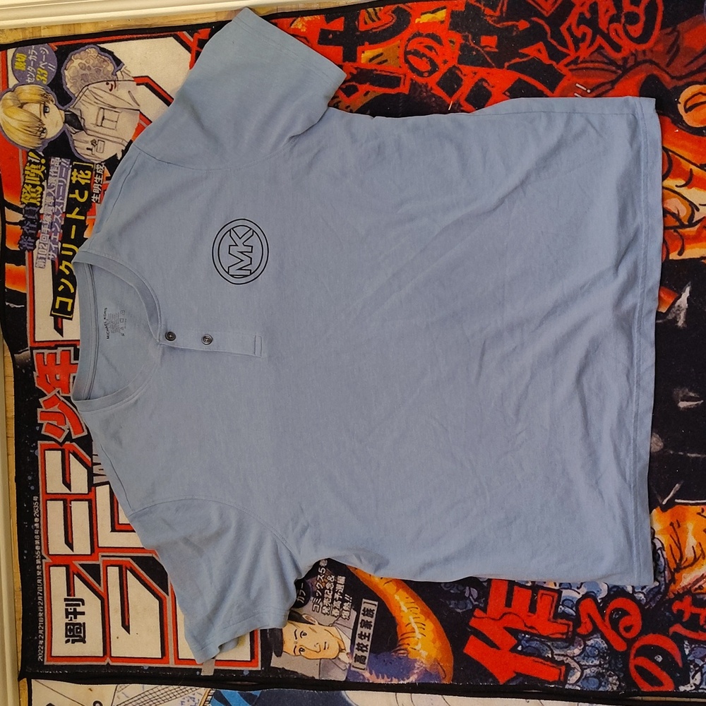 I have a lightly used but it's still like brand new no stains or flaws MK shirt